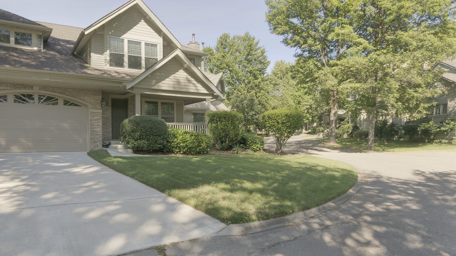 A suburban listing exterior photographed in full daylight